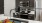 a kitchen with black cabinets