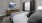 a bedroom with a bed and a painting on the wall and window