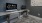 a work room with two computers and chairs