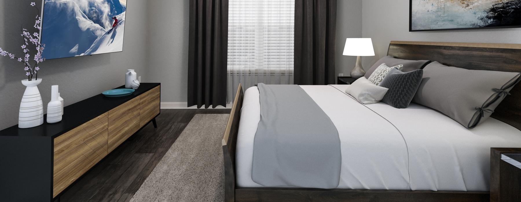 a bedroom with a bed and a tv and window