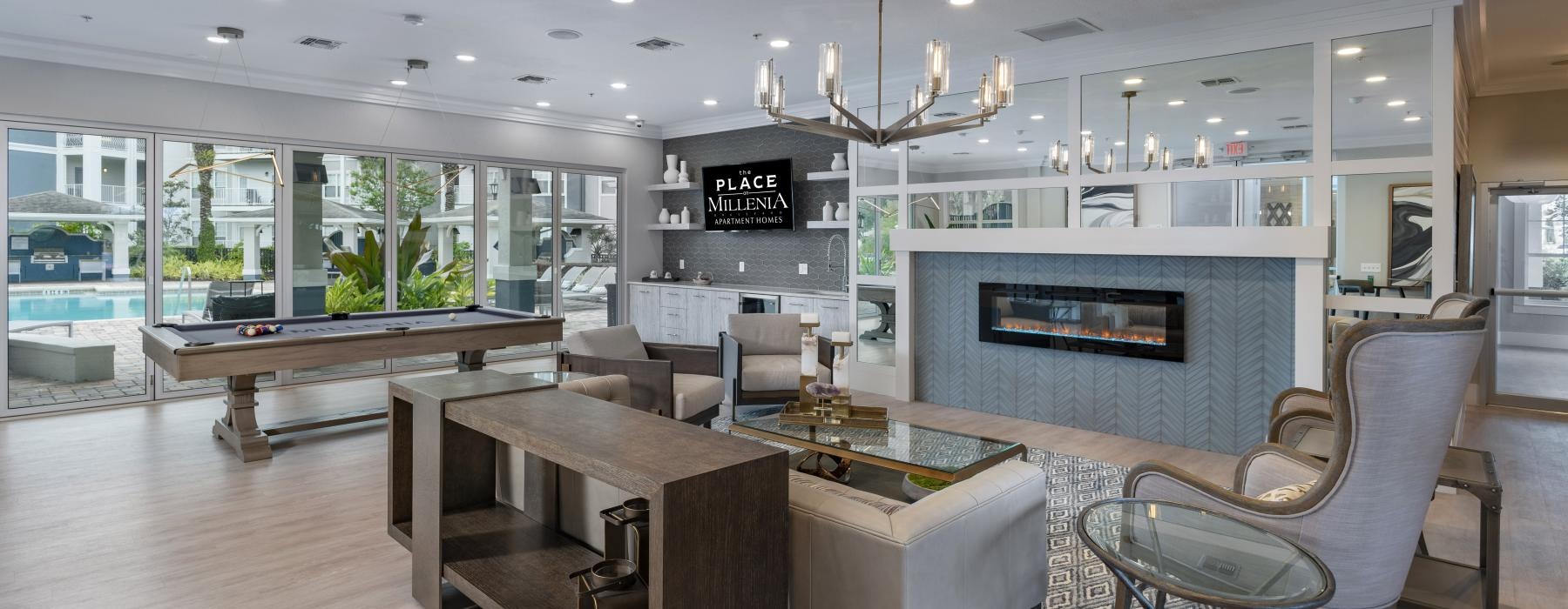 a large room with a fireplace and a table