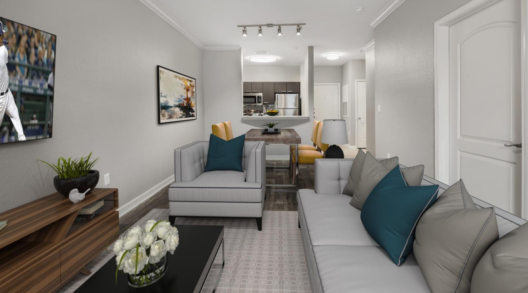 a living room with a couch and a table and chairs