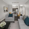 a living room with a couch and a table and chairs