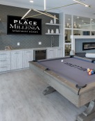 a large room with a fireplace and a large pool table