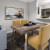 a dining room table with chairs leading into a kitchen